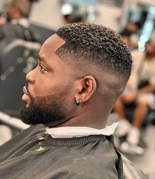 Mid fade haircut for Black men, balanced mid fade