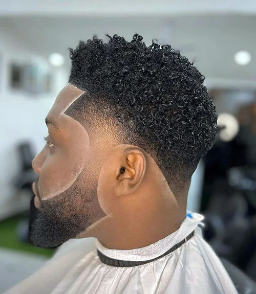 Low temp fade with thick medium curls for Black men