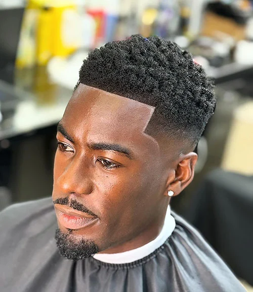 Short curly hair with low fade and goatee for Black men